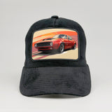 Vintage red muscle car on the Midnatt Velvet Trucker